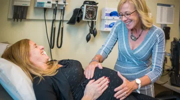 Pregnant woman being examined by her OBGYN
